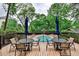 Pool deck with a lounge area and views of the surrounding trees at 1 Biscayne Nw Dr # 706, Atlanta, GA 30309