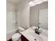 Clean bathroom featuring a vanity with marble top, a shower over tub, and modern fixtures at 3451 Meadow Grass Dr, Dacula, GA 30019