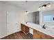 Bright bathroom with double sinks, a large mirror, modern fixtures, and a separate shower at 3451 Meadow Grass Dr, Dacula, GA 30019