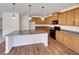 Modern kitchen featuring granite countertops, stainless steel appliances, and stylish pendant lighting at 3451 Meadow Grass Dr, Dacula, GA 30019