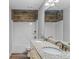 Bathroom featuring double sinks, granite countertops, and modern fixtures at 3462 Mount Zion Rd, Stockbridge, GA 30281
