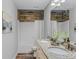 Bathroom featuring double sinks, granite countertops, and modern fixtures at 3462 Mount Zion Rd, Stockbridge, GA 30281