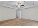 Spacious bedroom with neutral carpet, a ceiling fan, and a walk-in closet at 3462 Mount Zion Rd, Stockbridge, GA 30281