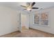 Bedroom featuring a ceiling fan, closet, and natural light from the window at 3462 Mount Zion Rd, Stockbridge, GA 30281