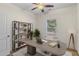 Staged home office featuring neutral carpeting, a ceiling fan, and a window for natural light at 3462 Mount Zion Rd, Stockbridge, GA 30281