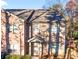 Charming two-story brick home with a cozy front porch and well-maintained landscaping at 3462 Mount Zion Rd, Stockbridge, GA 30281