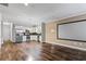 Open-concept living room and kitchen featuring hardwood floors and recessed lighting at 3462 Mount Zion Rd, Stockbridge, GA 30281