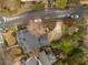 Aerial view of home, driveway, and landscaping in a residential neighborhood with street view at 567 E Wesley Ne Rd, Atlanta, GA 30305