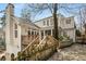 Exterior of home with a large wooden deck, fenced yard, and well-maintained landscaping at 567 E Wesley Ne Rd, Atlanta, GA 30305