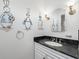 Bathroom featuring a white vanity with a black marble countertop and whimsical bunny wall art at 567 E Wesley Ne Rd, Atlanta, GA 30305