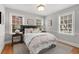 Bright bedroom with three large windows, decorative pillows and natural lighting at 567 E Wesley Ne Rd, Atlanta, GA 30305