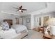 Bedroom featuring tray ceiling, ceiling fan, and natural lighting at 567 E Wesley Ne Rd, Atlanta, GA 30305