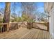 New wooden deck with railings and stairs leading to the backyard and garden at 567 E Wesley Ne Rd, Atlanta, GA 30305
