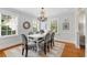 Formal dining room with chandelier lighting and three large windows at 567 E Wesley Ne Rd, Atlanta, GA 30305