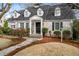 Charming painted brick home with dormer windows, walkway and manicured landscaping at 567 E Wesley Ne Rd, Atlanta, GA 30305
