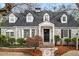 Charming brick home with a manicured front yard and inviting stone walkway and covered entryway at 567 E Wesley Ne Rd, Atlanta, GA 30305