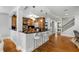 Modern kitchen with breakfast bar, pendant lighting, stainless steel appliances, and hardwood floors at 567 E Wesley Ne Rd, Atlanta, GA 30305