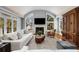 Bright living room with fireplace, hardwood floors, modern decor, and access to the outdoors at 567 E Wesley Ne Rd, Atlanta, GA 30305