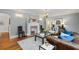 Spacious living room featuring hardwood floors, a fireplace, and sophisticated decor, perfect for relaxing and entertaining at 567 E Wesley Ne Rd, Atlanta, GA 30305