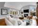 Open living room featuring high ceilings, fireplace, hardwood floors, and modern furnishings at 567 E Wesley Ne Rd, Atlanta, GA 30305