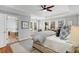 Spacious primary suite boasts tray ceilings, a ceiling fan, and oversized windows at 567 E Wesley Ne Rd, Atlanta, GA 30305