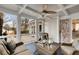 Relaxing screened-in porch with wicker furniture, ceiling fan, and views of the backyard at 567 E Wesley Ne Rd, Atlanta, GA 30305