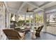 Cozy screened-in patio with ceiling fan and wicker furniture for comfortable outdoor living at 567 E Wesley Ne Rd, Atlanta, GA 30305