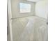 Clean, bright bedroom with large window offering great natural light and neutral carpeting for easy customization at 6921 Foxmoor Way, Douglasville, GA 30134