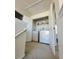 Laundry room with washer, dryer, and shelving at 6921 Foxmoor Way, Douglasville, GA 30134