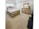 Bright main bedroom with carpet, dresser, and a large window at 6921 Foxmoor Way, Douglasville, GA 30134