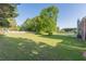 Large backyard featuring a green lawn and wood fence at 104 Sunflower Meadows Dr, Mcdonough, GA 30252