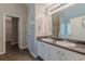 Bathroom featuring double vanity, granite countertop and modern fixtures at 104 Sunflower Meadows Dr, Mcdonough, GA 30252
