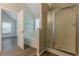 Bathroom with tile surround tub, shower and views into another bedroom at 104 Sunflower Meadows Dr, Mcdonough, GA 30252