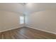 Bedroom featuring wood-look floors, neutral paint, vaulted ceiling, and natural light at 104 Sunflower Meadows Dr, Mcdonough, GA 30252