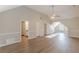 Bright bedroom with vaulted ceiling, several doors and wood-look flooring at 104 Sunflower Meadows Dr, Mcdonough, GA 30252