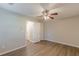 Bedroom with natural light and wood-look laminate flooring with three entry doors at 104 Sunflower Meadows Dr, Mcdonough, GA 30252