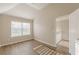 Spacious bedroom with vaulted ceiling, window, and staircase access at 104 Sunflower Meadows Dr, Mcdonough, GA 30252