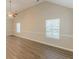 Bright bedroom with ceiling fan, large windows, and wood-look flooring at 104 Sunflower Meadows Dr, Mcdonough, GA 30252