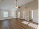 Large bedroom with vaulted ceiling and wood-look floors with multiple entryways at 104 Sunflower Meadows Dr, Mcdonough, GA 30252