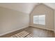 Bedroom with high vaulted ceiling and window overlooking yard at 104 Sunflower Meadows Dr, Mcdonough, GA 30252