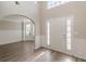 Open foyer with hardwood floors, high ceilings, and wainscoting throughout at 104 Sunflower Meadows Dr, Mcdonough, GA 30252