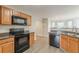 Inviting kitchen with oak cabinetry and modern appliances, perfect for cooking and entertaining at 104 Sunflower Meadows Dr, Mcdonough, GA 30252