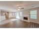 Living room shows an open floor plan, a fireplace, and wood floors at 104 Sunflower Meadows Dr, Mcdonough, GA 30252