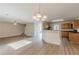 Living room shows open floor plan with staircase, wood floors and kitchen at 104 Sunflower Meadows Dr, Mcdonough, GA 30252