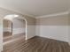 Spacious living room features wainscotting, fresh neutral paint, and beautiful floors at 104 Sunflower Meadows Dr, Mcdonough, GA 30252