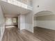 Open-concept living room featuring hardwood floors and plenty of natural light at 104 Sunflower Meadows Dr, Mcdonough, GA 30252