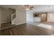 Living room features a staircase, wood floors, and kitchen at 104 Sunflower Meadows Dr, Mcdonough, GA 30252