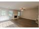 Living room features a door, windows, fireplace, and wood floors at 104 Sunflower Meadows Dr, Mcdonough, GA 30252