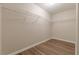 Empty walk-in closet with wire shelving and wood-look flooring at 104 Sunflower Meadows Dr, Mcdonough, GA 30252