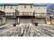 Townhome back exterior with multiple garage parking at 1869 Appaloosa Mill Ct, Buford, GA 30519
